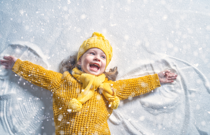 Kid Making Snow Angel